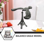 The gravity-defying metal bird statue with its Eiffel Tower base, presented as an elegant home decor item.