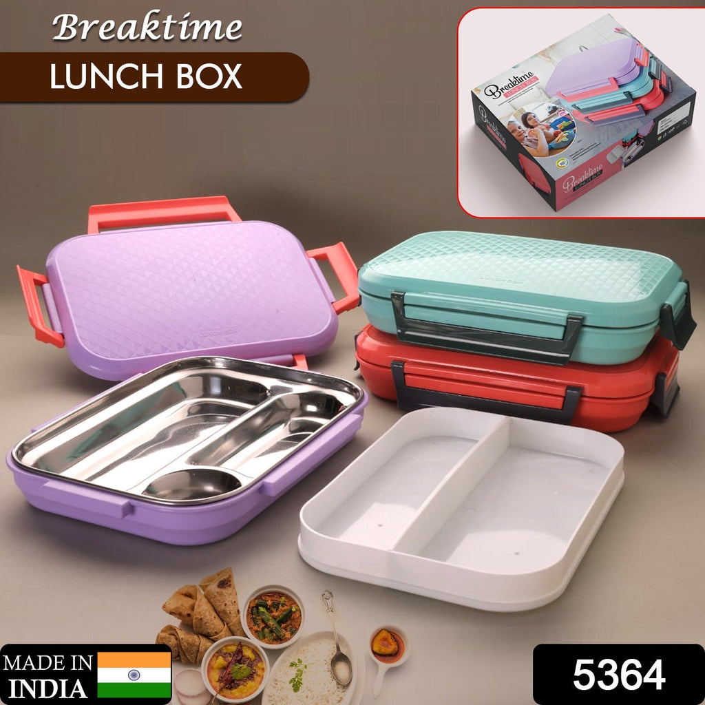 Organised steel compartments of the tiffin box, ready for packing diverse Indian meals.