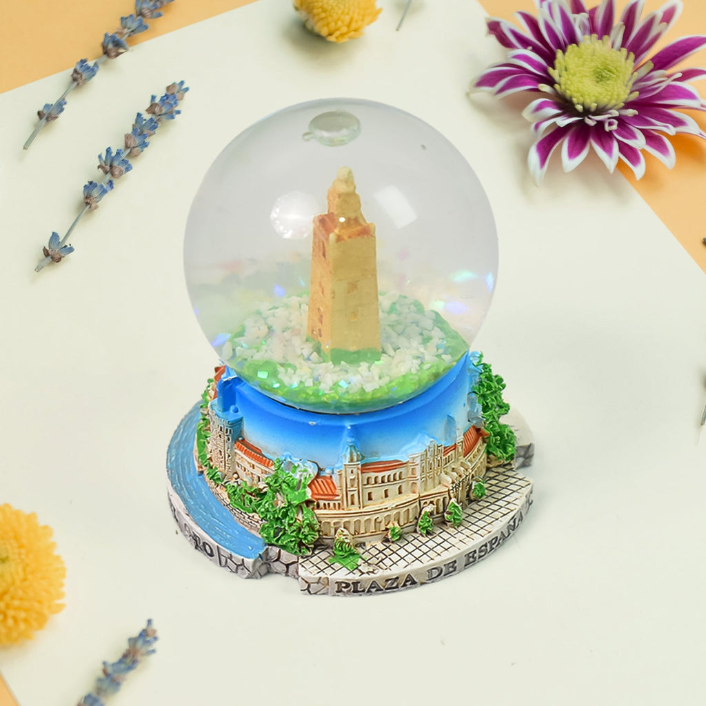 A beautifully crafted decorative snow globe featuring a festive scene, perfect for desk decor.