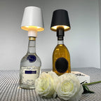 The versatile LED bottle lamp illuminating various colored wine bottles.