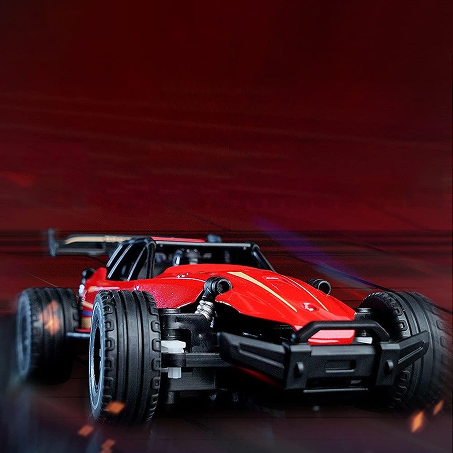 Side profile of red off-road remote control car with rugged tires