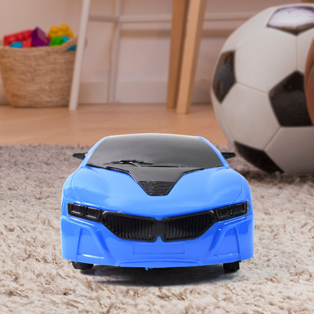 Child's hand holding the easy-to-use remote, controlling the racing car in motion.