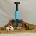 Detailed view of the sharp, triple stainless steel blades inside the food chopper for precision.