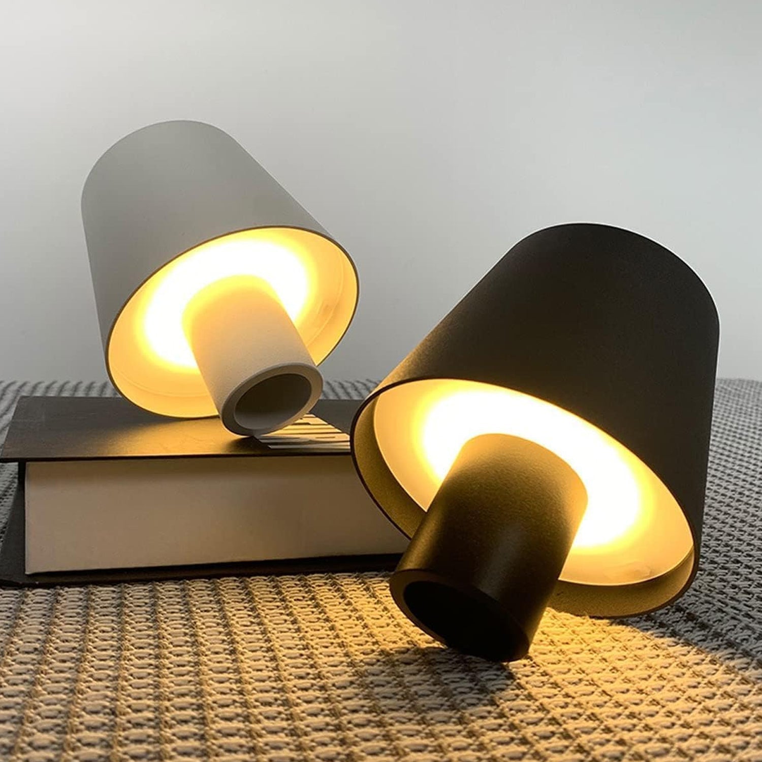USB rechargeable LED bottle lamp glowing softly on a wooden table, showcasing dimmable light.