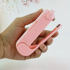 Person demonstrating the quick and easy sealing process with the Mini Plastic Bag Sealer.