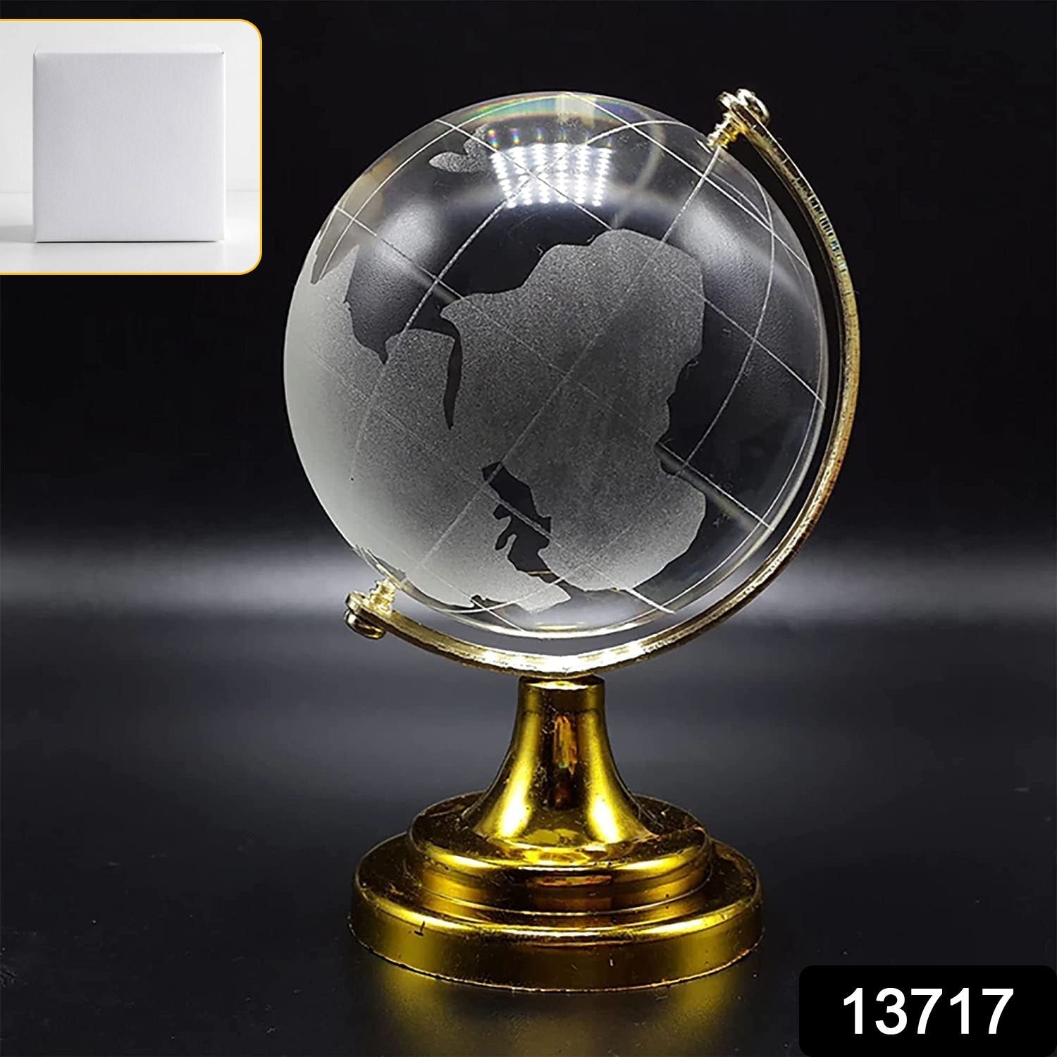 Close-up of a Crystal World Globe showing detailed world map etching on a golden stand.