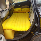 Inflatable car bed providing a cozy sleeping space in a car for a relaxed journey.