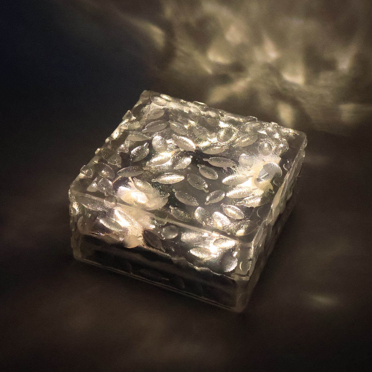 Close-up of a waterproof solar garden light, showcasing its frosted glass texture.