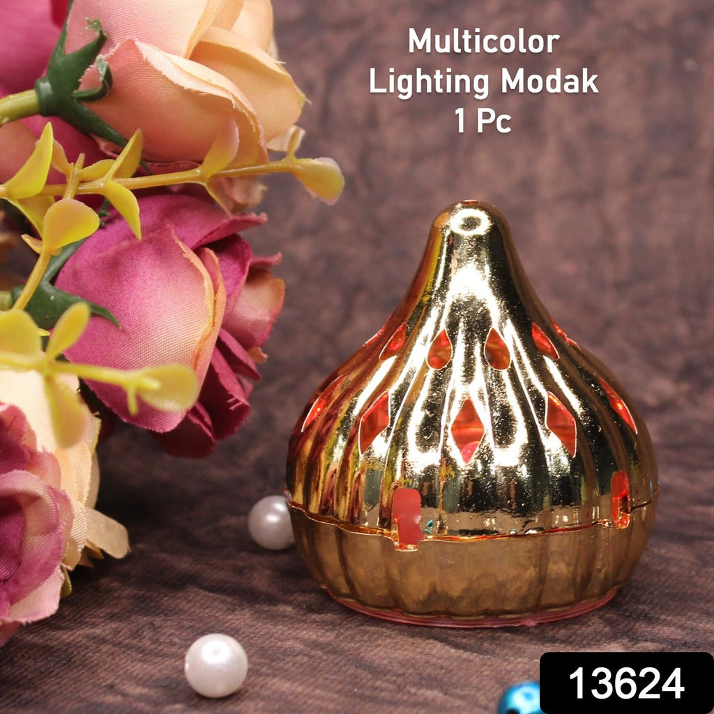 Close-up of a glowing Modak LED light, adding a warm ambiance to a festive setting.