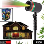 Multicolor outdoor laser projector displaying star motion patterns on a house.