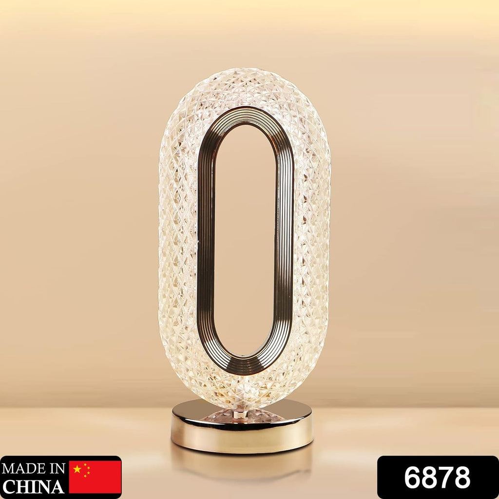 USB rechargeable crystal table lamp glowing with a warm light.