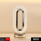 USB rechargeable crystal table lamp glowing with a warm light.