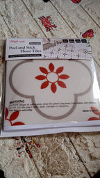 Stack of waterproof vinyl tile sticker sheets ready for home decoration projects.