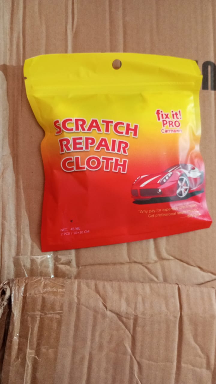 Shiny car surface after successful scratch removal, showcasing a flawless paint finish.