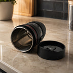Top down view of the camera lens coffee mug, highlighting the detailed lid.