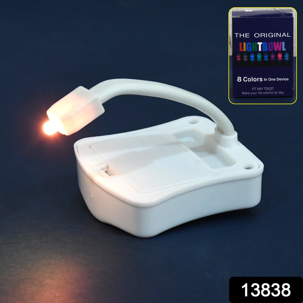 Close-up of the easy-to-install LED toilet night light attached to a toilet rim.